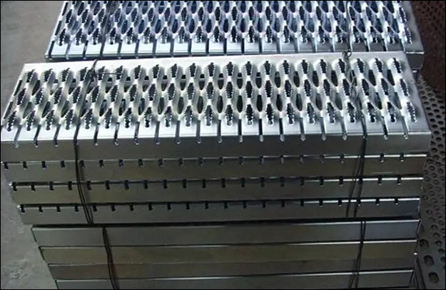 Perforated stair tread plates with non slip serrated edge